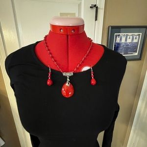 Costume jewelry set of necklace and earrings. Red stones and beads silver tone.